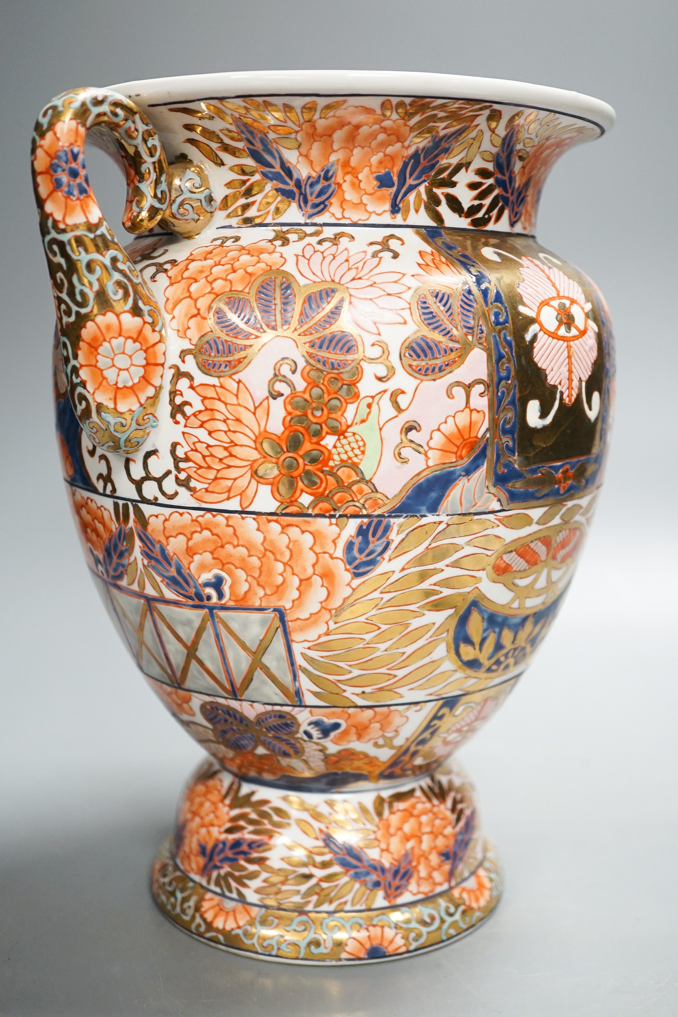 A twin handled Imari palette vase, a Japanese eggshell porcelain footed bowl, together with an 18th century Chinese porcelain bowl and saucer (with damage) 25cm (4)